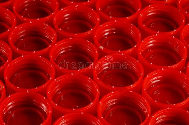 可循环再用的材料.红色的capitals大写字母从瓶子使关于高的-demand需要nsitypolyethylene高密度聚乙烯