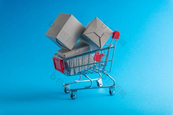 购物运货马车和盒向<strong>蓝色背景</strong>,<strong>商业</strong>和购物