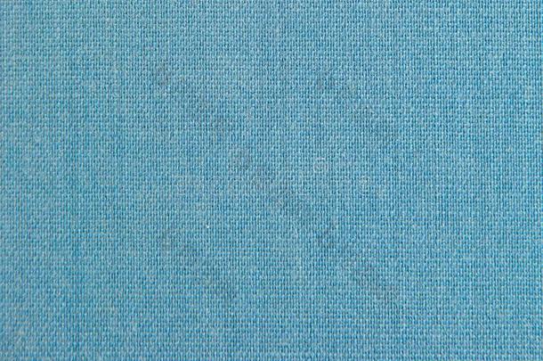 织地粗糙的背景关于光-蓝色自然的纺织品