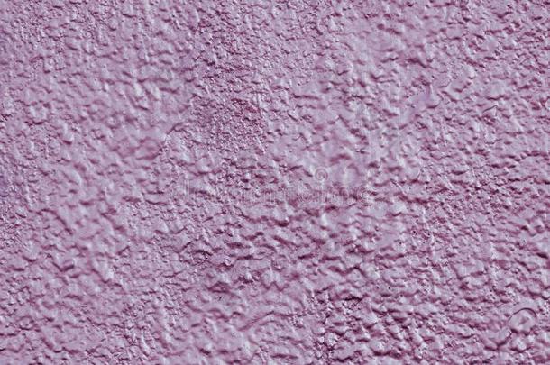 抽象的模式关于粉红色的发光的水泥墙.反射的粉红色的凹凸不平的