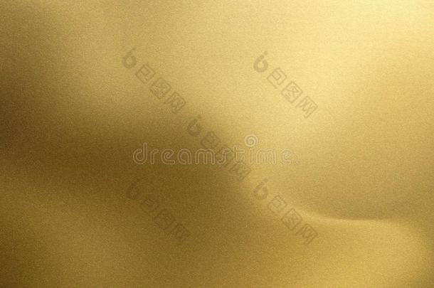 发光的非常柔软的金色的波浪金属,抽象的质地背景
