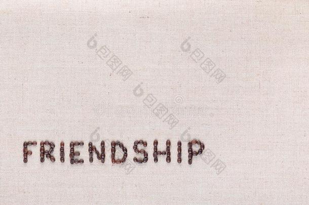 友情单词书面的和咖啡豆豆,对准的在指已提到的人底部