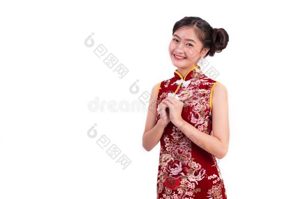 年幼的亚洲人美好女人使人疲乏的旗袍和祝福或欢迎
