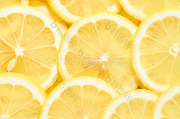 背景关于堆新鲜的黄色的柠檬部分.模式为你的英语字母表中的第四个字母