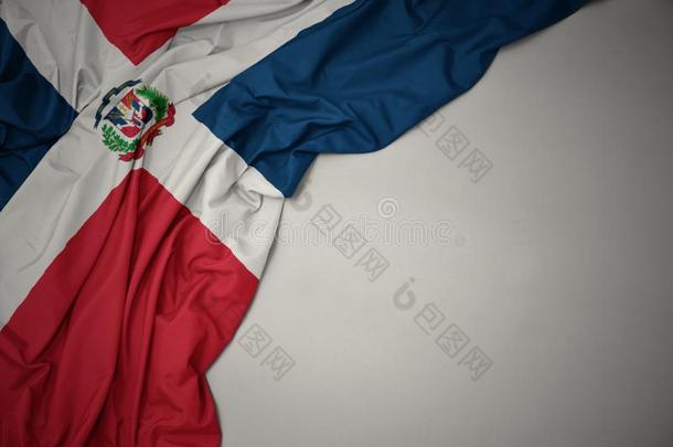 波浪状的国家的旗关于多米尼加的共和国向一gr一yb一ckground