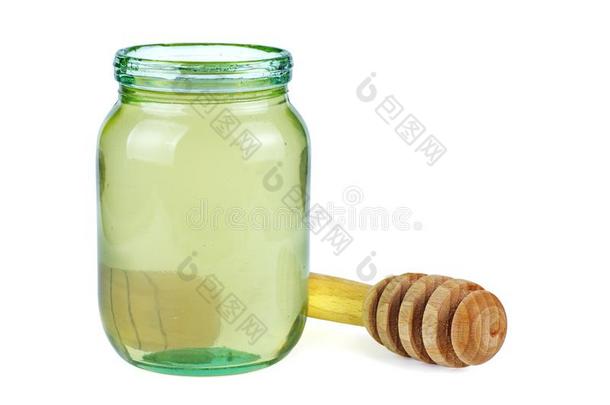 断开的玻璃罐子和白色的阿拉伯树<strong>胶</strong>蜂蜜和木制的<strong>粘贴</strong>在近处
