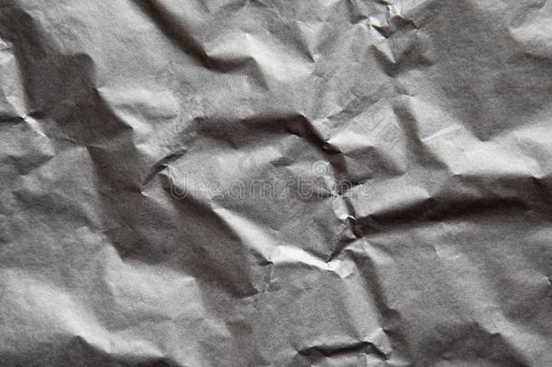 光灰色摺皱的纸质地.抽象的背景.