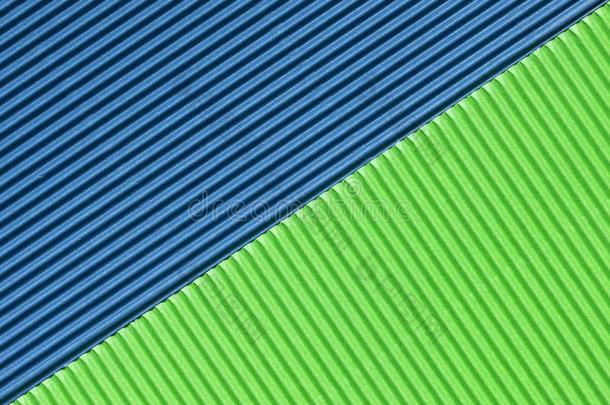 织地粗糙的富有色彩的蓝色和绿色的波纹的卡纸板
