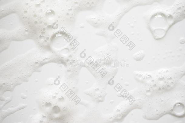 抽象的背景白色的含有肥皂的起泡沫质地.洗发剂起泡沫和