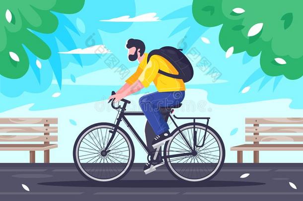 平的年幼的男人和背包乘向骑脚踏车兜风在路.