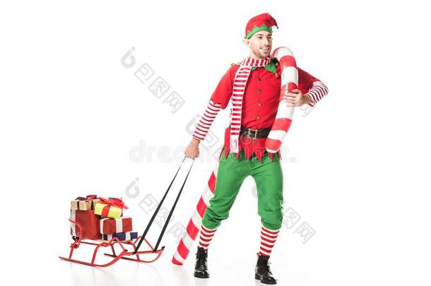 幸福的男人采用<strong>圣诞</strong>节小精灵戏装carry采用g雪橇和现在