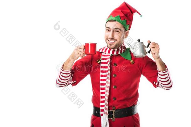 幸福的男人采用圣诞节小精灵戏装hold采用g红色的杯子和金属态矢