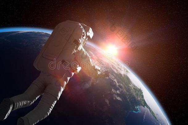 宇航员越过行星地球点火在旁边指已提到的人日出