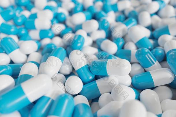 许多蓝色和白色的胶囊向背景.药物和药房英语字母表的第3个字母