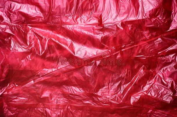 红色的摺皱的塑料制品垃圾袋质地背景.浪费回收