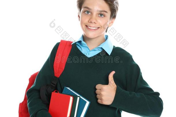 幸福的男孩采用学校制服向背景