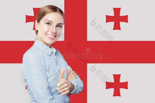幸福的女孩学生拇指在上面反对反对指已提到的人美国佐治亚州旗