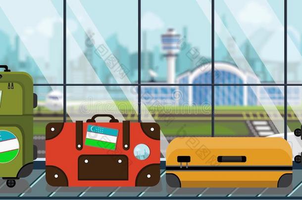行李和Uzbekistan乌兹别克斯坦旗有背胶的标签向行李旋转木马采用机场,