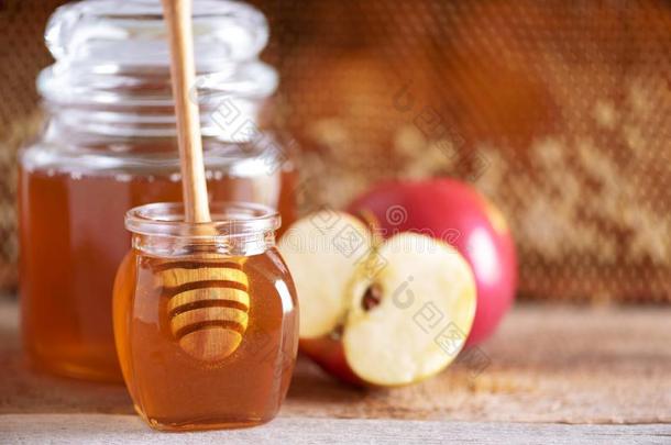 苹果和蜂蜜罐子,蜂蜜comb向灰色的背景和复制品speciality专业