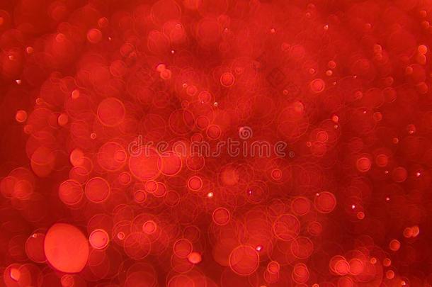 抽象的闪耀焦外成像光影响和红色的背景,埃斯特拉