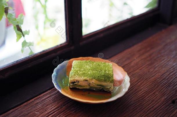 自家制的班诺菲馅饼和日本<strong>抹茶</strong>绿色的茶水,使从新鲜的裂口
