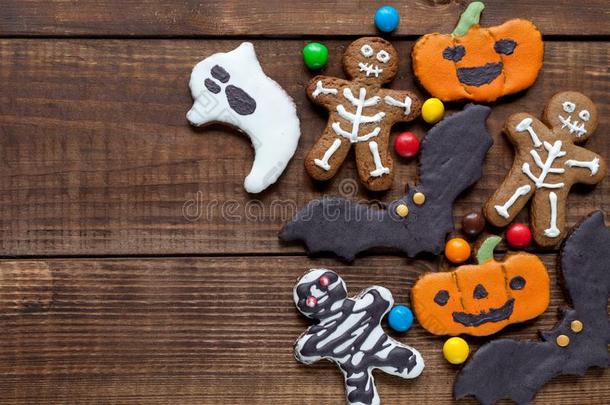 万圣节前夕甜饼干:蝙蝠,南瓜,骨架,铸造向黑暗的木材design设计