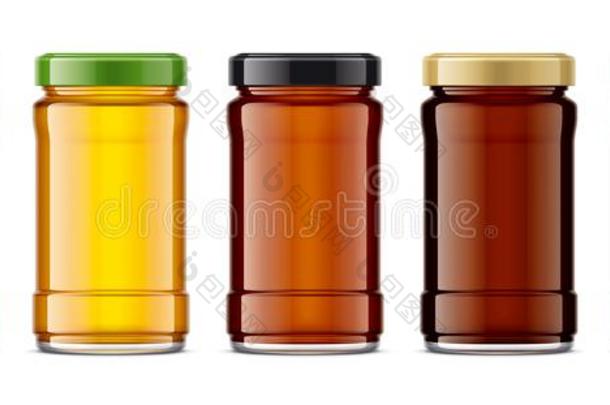 放置关于玻璃罐子和蜂蜜.
