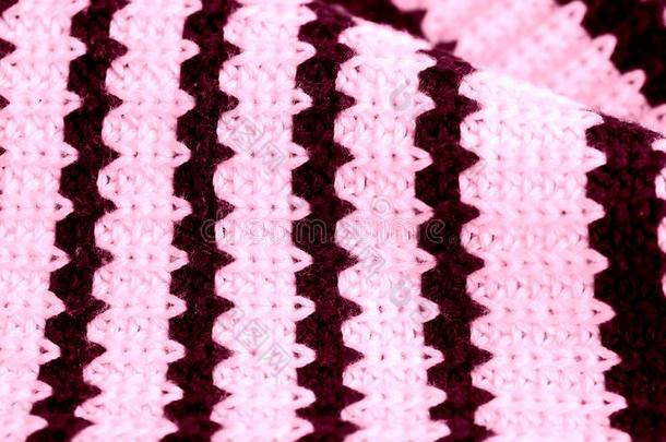 有条纹的针织品质地关-在上面.纺织品背景粉红色的颜色