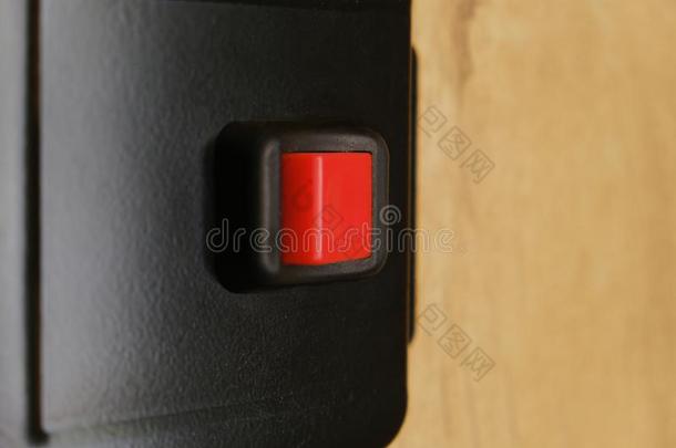 特写镜头射手关于一sm一ll红色的按钮开关向blur红色的b一ckground