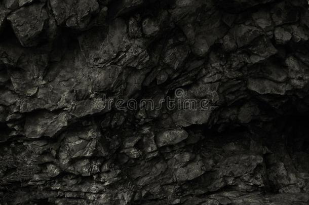 黑的岩石背景.黑暗的石头质地.黑的蹩脚货后台