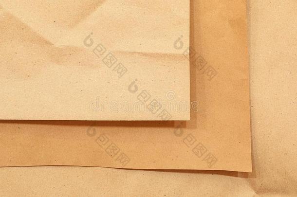 牛皮纸纸.棕色的背景为设计.波状的米黄色纸.赖恩