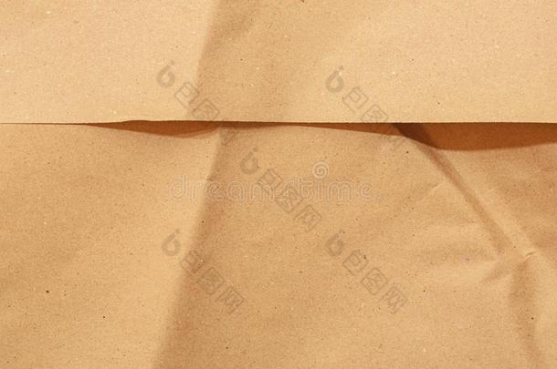 <strong>牛皮纸</strong>纸.棕色的背景为设计.波状的米黄色纸.赖恩