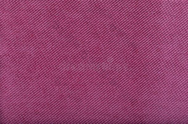 关-在上面关于粉红色的织物表面,小的一针同样地背景