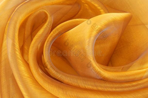 金色的透明硬纱织物波状的质地
