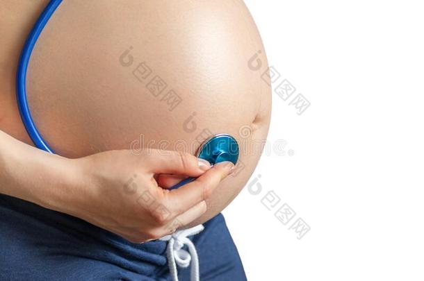 怀孕的女人佃户租种的土地听诊器向怀孕的肚子,考试
