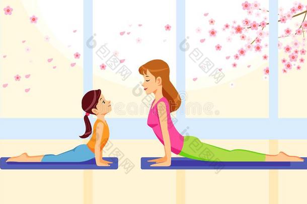 幸福的微笑的母亲和女儿同时做瑜伽练习