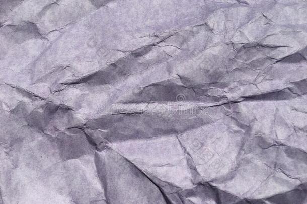 抽象的现代的紫色的摺皱的纸质地背景