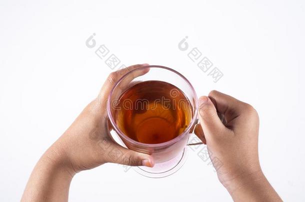 喝茶水,轻松,舒适的照片反对一白色的b一ckground