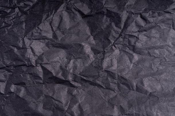 黑暗的有皱纹的起折痕黑的纸海报质地.空白的起折痕