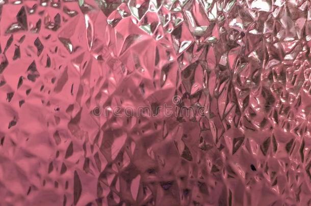 玻璃小颗粒和粉红色的,恶劣的,织地粗糙的背景