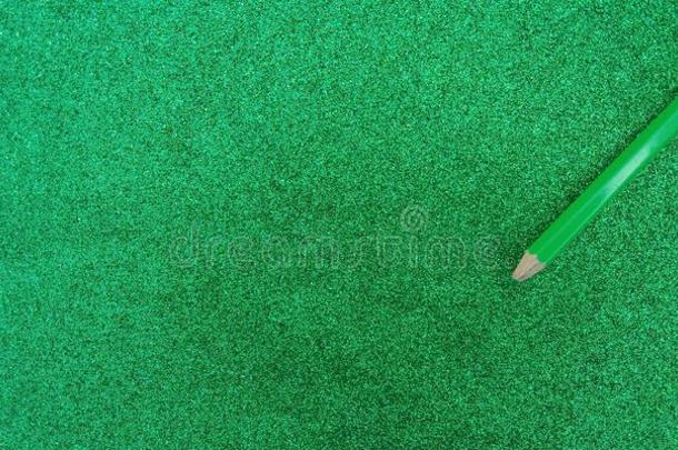 绿色的织地粗糙的背景和闪烁影响和铅笔后座议员