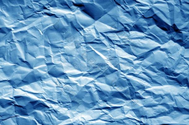 摺皱的纸关于纸采用海军蓝色声调.