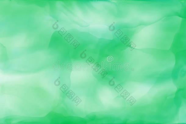 绿色的抽象的艺术的旋转水彩墨水背景