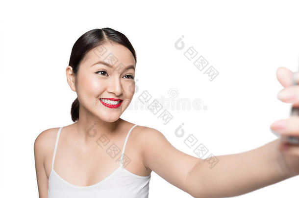 美丽的亚洲人女人和制动火箭化妆迷人的自拍照照片弧点元