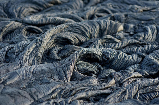 光滑的,波动表面关于冷冻的绳状熔岩熔岩.冷冻的熔岩