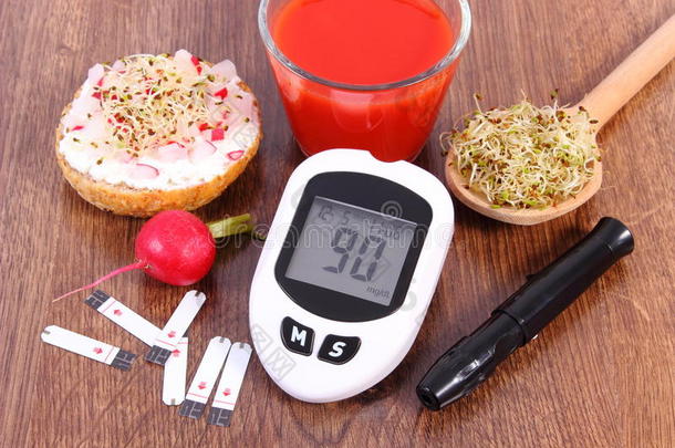 葡萄糖计量器和附件为糖尿病的和健康的食物和