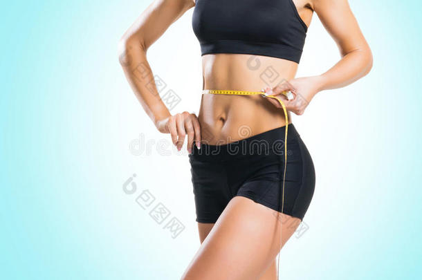 适合,健康的和像运动家的女人采用运动装measur采用g她身体我