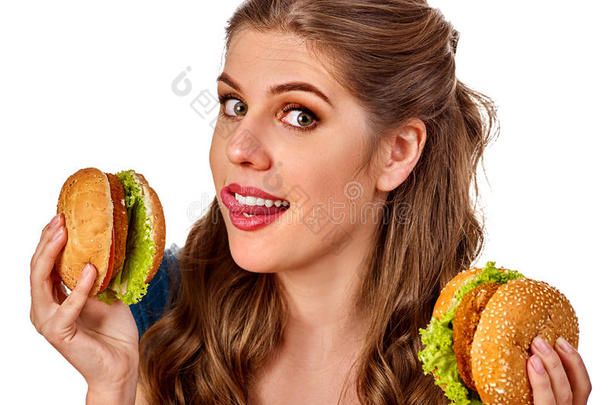 女人吃<strong>汉堡</strong>包.学生消耗快的食物向表.