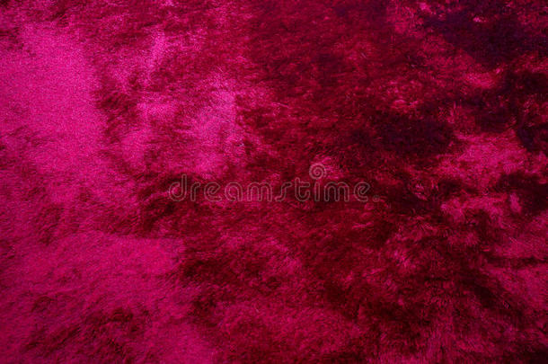地毯质地.粉红色的地毯背景关在上面.