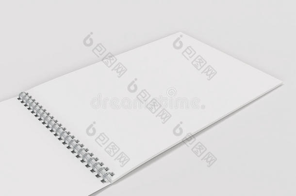 敞开的空白的白色的笔记簿和金属螺旋跳向白色的后面